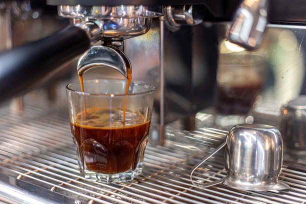 istock Making coffee by a barista in a coffee machine. The coffee machine makes coffee. 2179008062