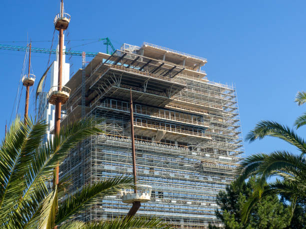 istock Building under construction. House frame in scaffolding. Construction industry. 2179011709