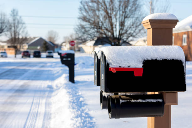 istock Snow covered mailbox after winter storm. Winter weather and postal mail delivery concept. 2179013743