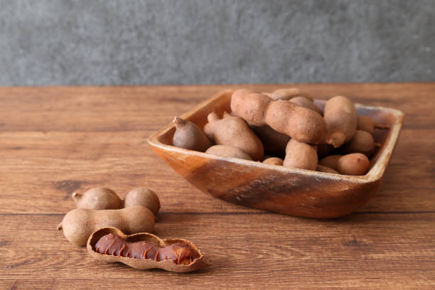 istock Tamarinds in a bowl isolated on a wooden background. 2179016061