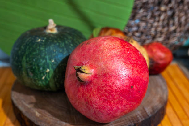 istock Autumn colors with pomegranate and pumpkin 2179021878