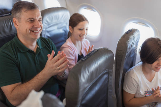 istock People clapping hands to a pilot after landing the plane 2179023619