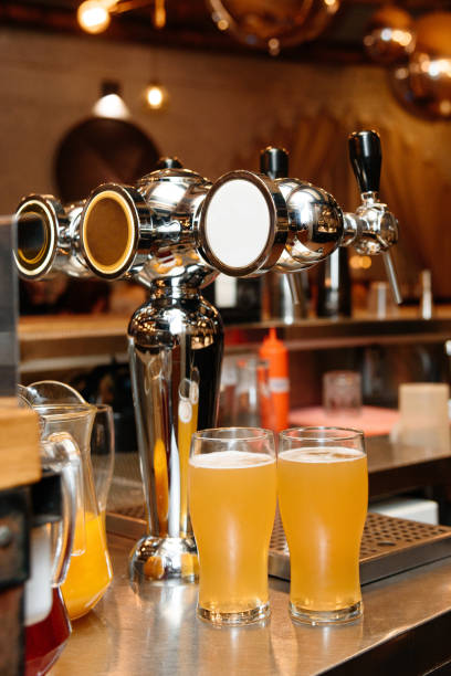 istock two large glasses of beer on bar counter 2179027109