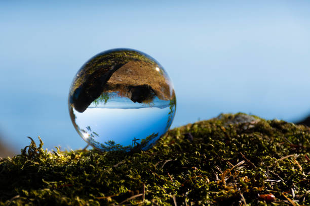 istock Photographic Lens Ball and Ocean 2179038116
