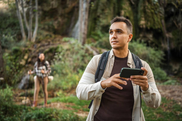 istock Adult man hiker backpacker look for path on mobile phone 2179044042