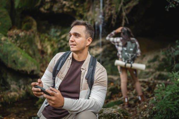 istock Adult man hiker backpacker look for path on mobile phone 2179047227