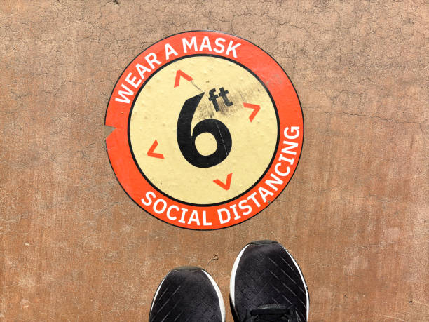 Old Sign/Sticker on Floor: Wear Mask, 6 Ft Social Distancing