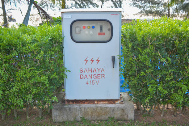 istock Kuantan, Malaysia: October 17th, 2024- The image shows a white electrical panel with a metal door and a warning sign. 2179060069