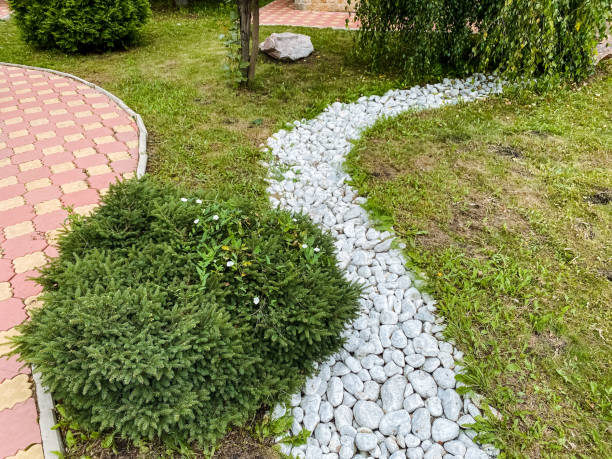 istock A picturesque path in a beautifully maintained garden, featuring white decorative rocks along with a charming brick walkway that invites visitors to enjoy the surrounding beauty of nature 2179079263