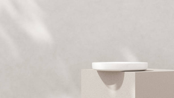 istock Minimalistic, simple, and light background for product presentation. Streaming sunlight casts soft shadows from a window onto a white-gray wall and floor, creating a clean and elegant atmosphere. 2179082664