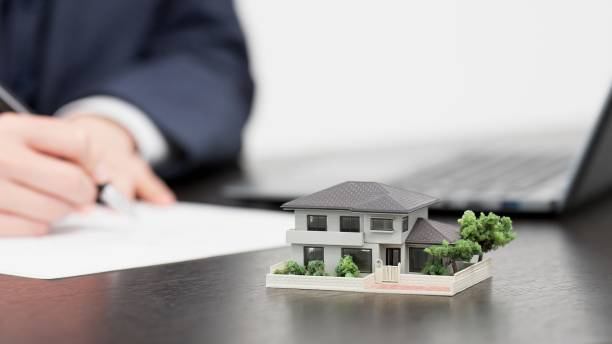 istock Hands of a businessman creating real estate documents 2179086977