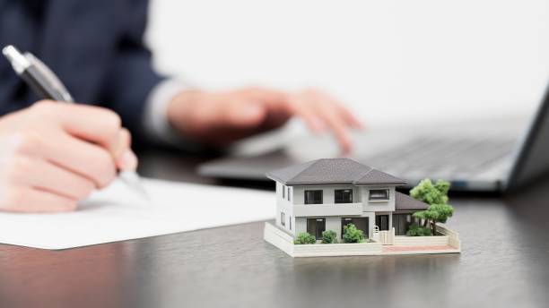 istock Hands of a businessman creating real estate documents 2179086983