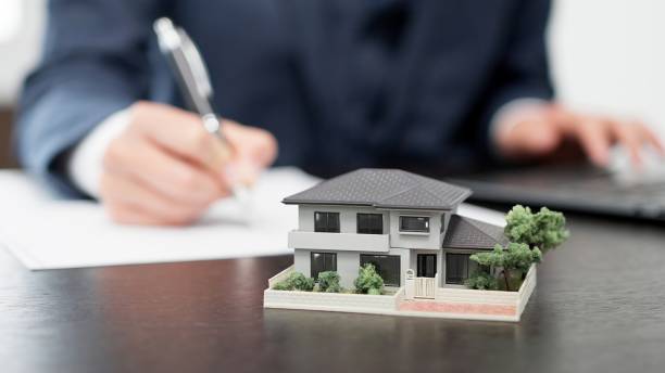 istock Hands of a businessman creating real estate documents 2179087041