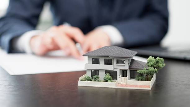 istock Hands of a businessman creating real estate documents 2179087047