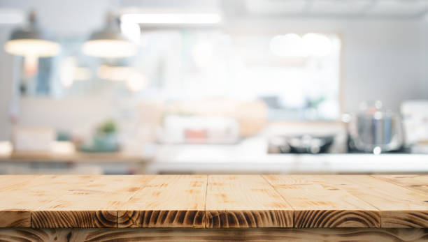 istock End grain wood counter table top on blur white wall kitchen background.For montage product display 2179096326