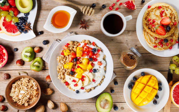 istock healthy breakfast table with coffee, pancakes, fruits and cereals 2179096541