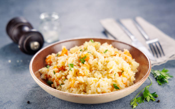 istock risotto with pumpkin, nuts and parmesan 2179103334