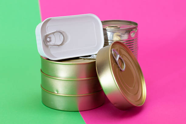 istock A Group of Stacked Tin Cans on Split Green and Cyan Background 2179105805