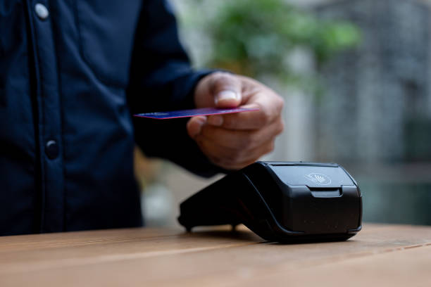istock Customer paying using credit card on pos terminal in cafe 2179105936