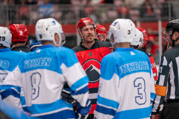 istock Players and Referees in Discussion During Hockey Game 2179108787