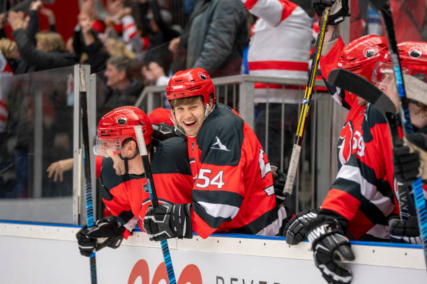 istock Joyful Ice Hockey Players on the Bench 2179108934