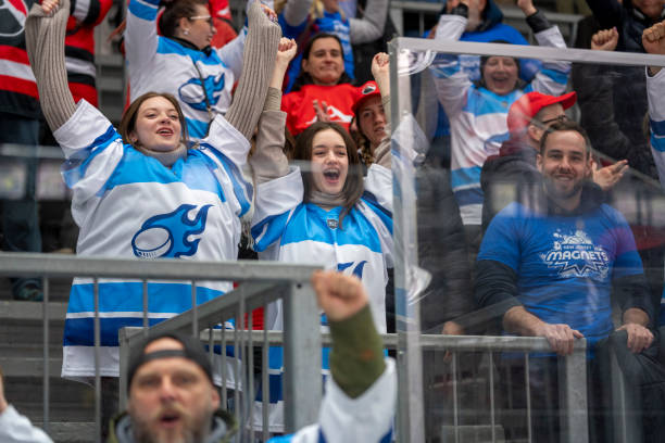 istock Enthusiastic Ice Hockey Fans Cheering 2179108974