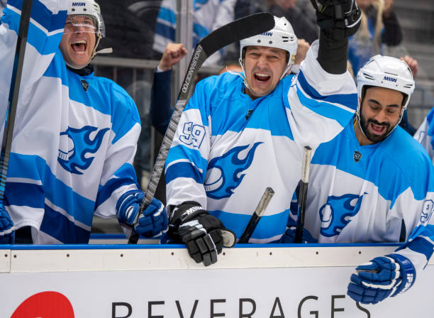 istock Ecstatic Ice Hockey Players Celebrating on the Bench 2179108993