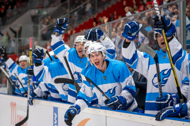 istock Ecstatic Ice Hockey Players Celebrating on the Bench 2179109055