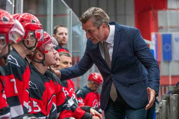 istock Hockey Coach Motivating His Team on the Bench 2179109084