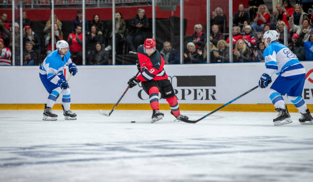 istock Hockey Players Battling for Puck Control 2179109347
