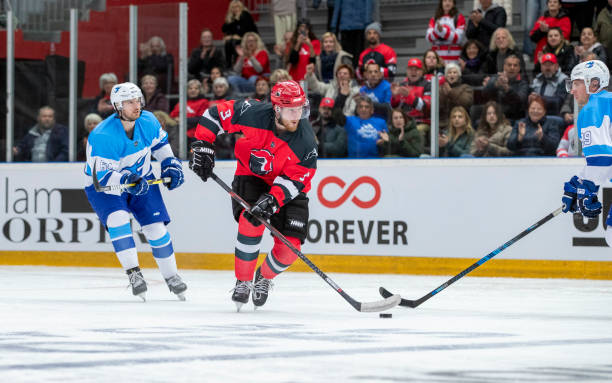 istock Intense Ice Hockey Game Action with Competing Teams 2179109402