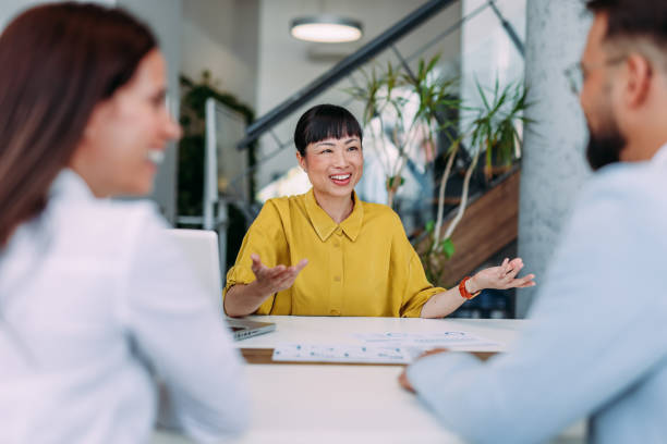 istock Group of business persons talking in the office. 2179110817
