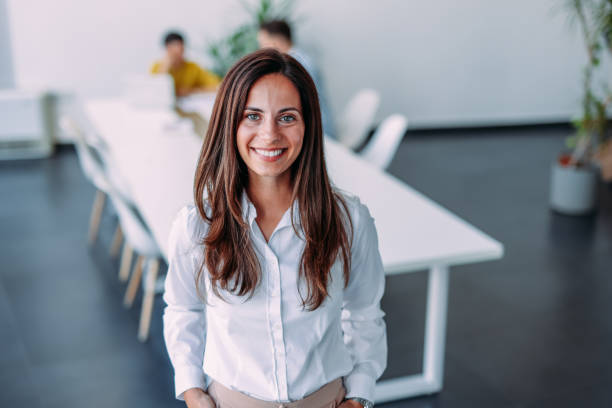 istock Confident businesswoman and her team. 2179110819