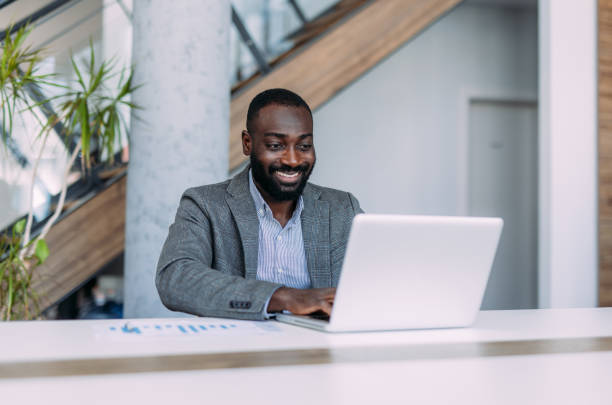 istock Successful businessman in modern office working on laptop. 2179110849