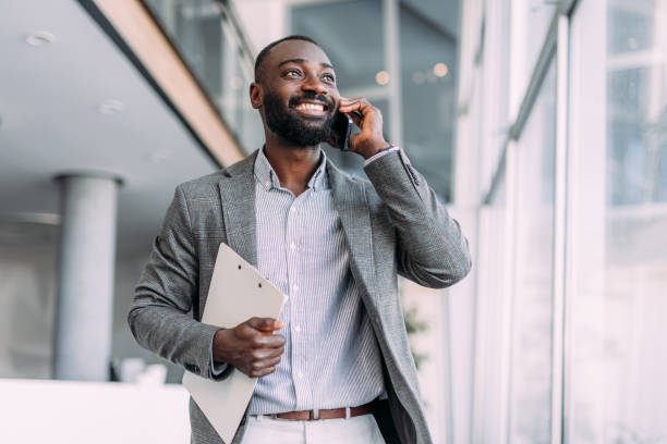 Businessman talking on the phone in the office.
