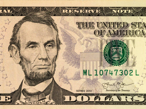 istock Close-Up Abraham Lincoln Portrait On US Five Dollar Bill 2179111587