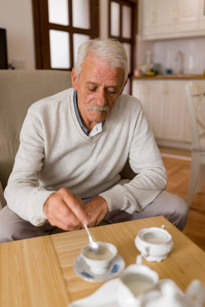 istock Senior man enjoying cup of tea at home 2179114280