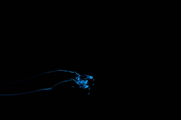 istock gamer's silhouette in the dark 2179120822