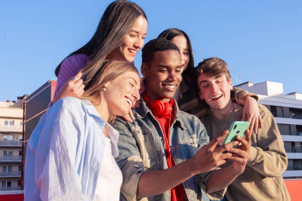 istock Students having fun with mobile phones creating content on social media. 2179121695