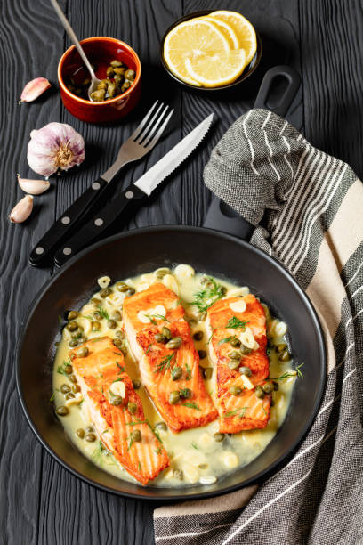 istock salmon piccata with lemon caper sauce in a pan 2179128898