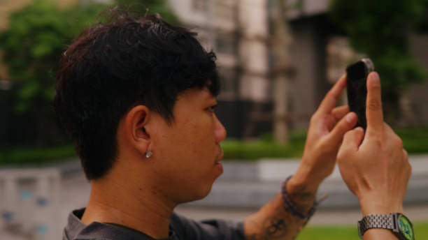 istock Happy Asian man using smartphone taking a photo. 2179134936