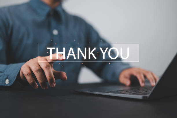 istock businessman using a laptop and touching the message thank you on a display screen. concept of thank you business, congratulations, and appreciation gratitude. presentation from technology digital 2179148216
