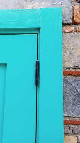 istock blue wooden door with hinges. 2179150416