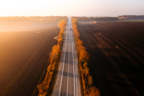 istock Panoramic view from above of the freeway passing through agricultural fields in the morning light. 2179153604