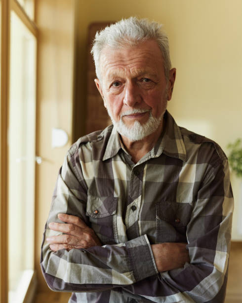 istock Senior man with crossed arms at home. 2179155146