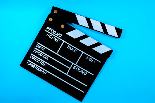 istock Film clapperboard on blue background 2179155400