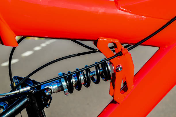 istock A red bicycle with a black chain and a black seat 2179156074