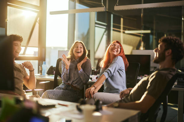 istock Cheerful designers talking on a break in the office. 2179157656