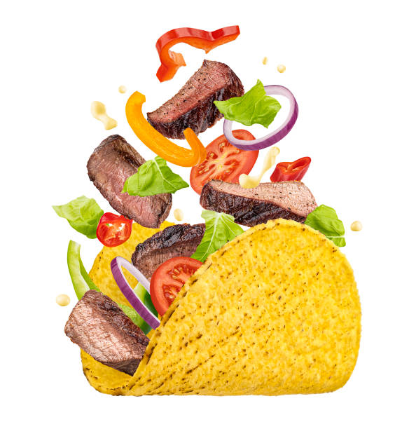 Mexican taco with falling beef meat and vegetables isolated on white background