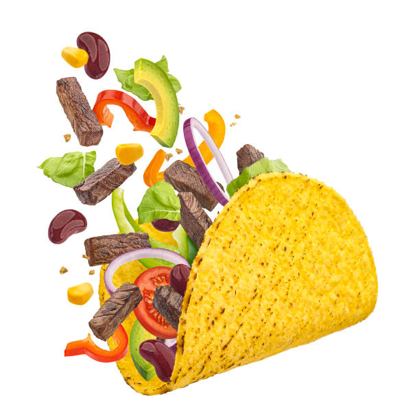 Mexican taco with falling beef meat and vegetables isolated on white background